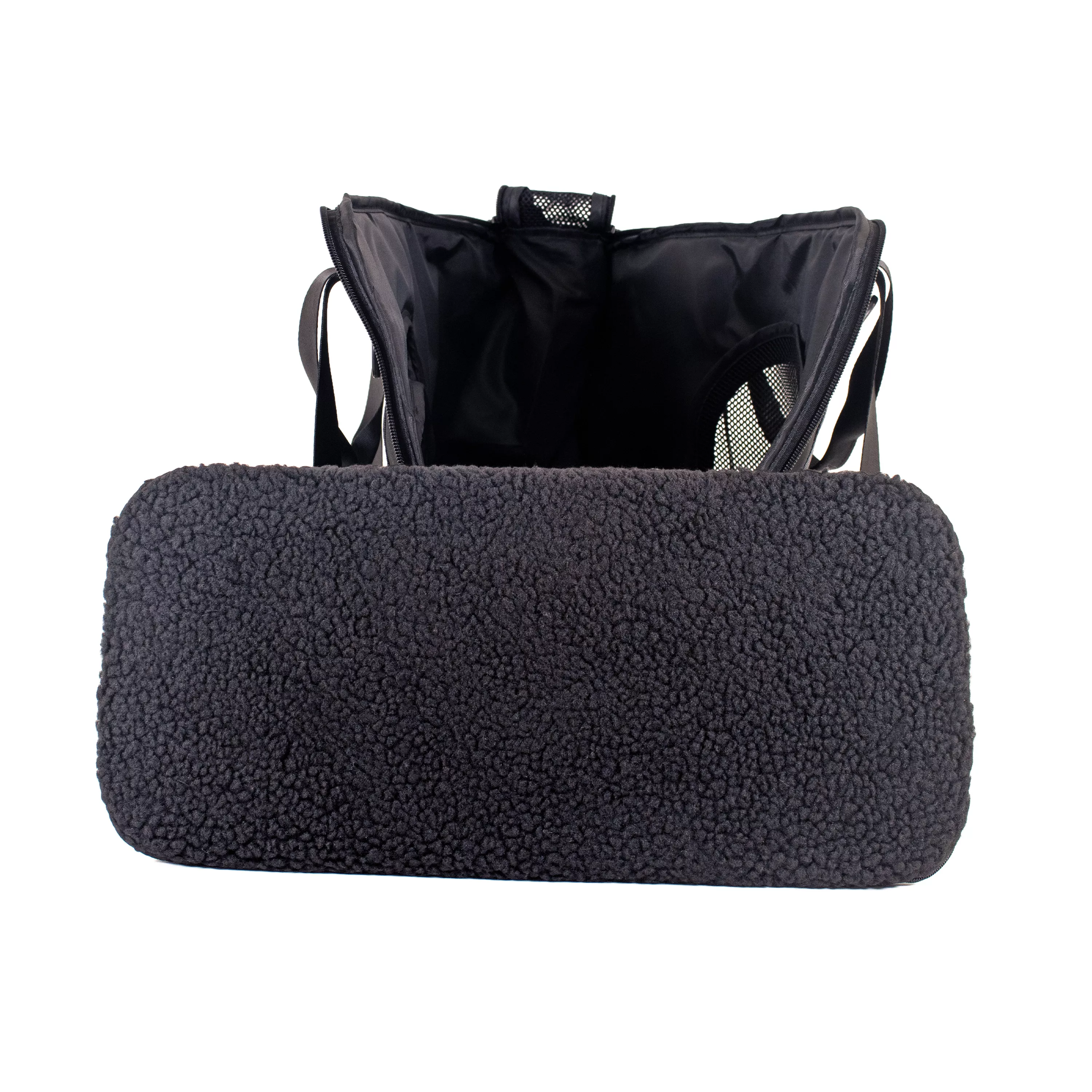 Side view of the tote pet carrier with the removable fleece pad fully removed and positioned in front of the carrier.