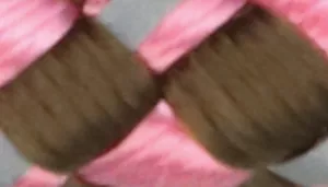 Woven pattern with olive brown strands crossed over bright pink strands.