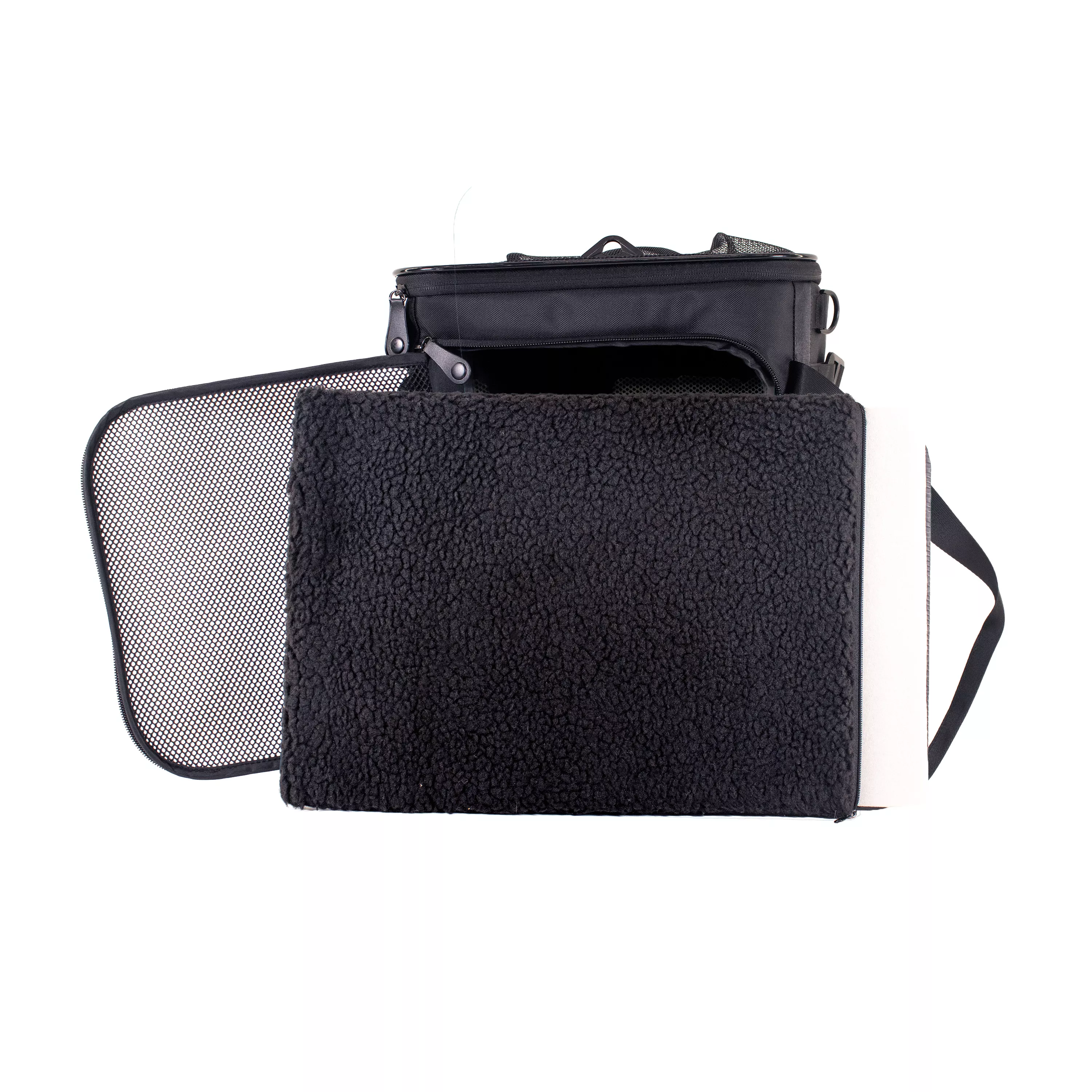 Side view of the dome‑style pet carrier with the removable fleece pad pulled out and resting in front of the open doorway.