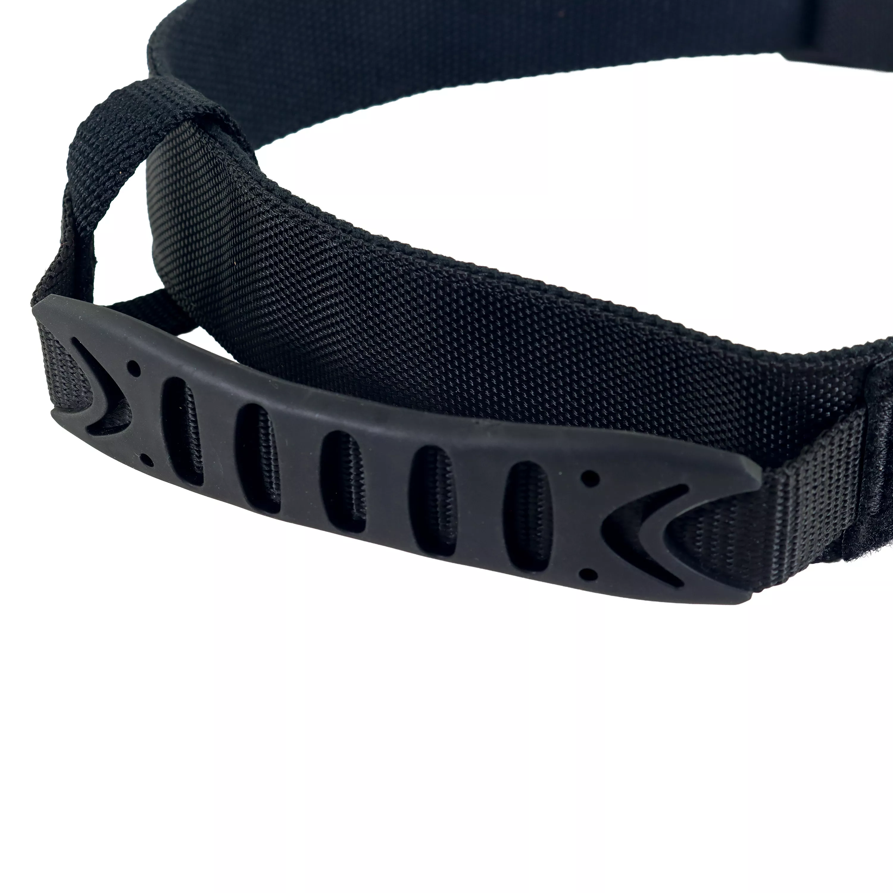 Angled close‑up of a black dog collar handle along the strap.