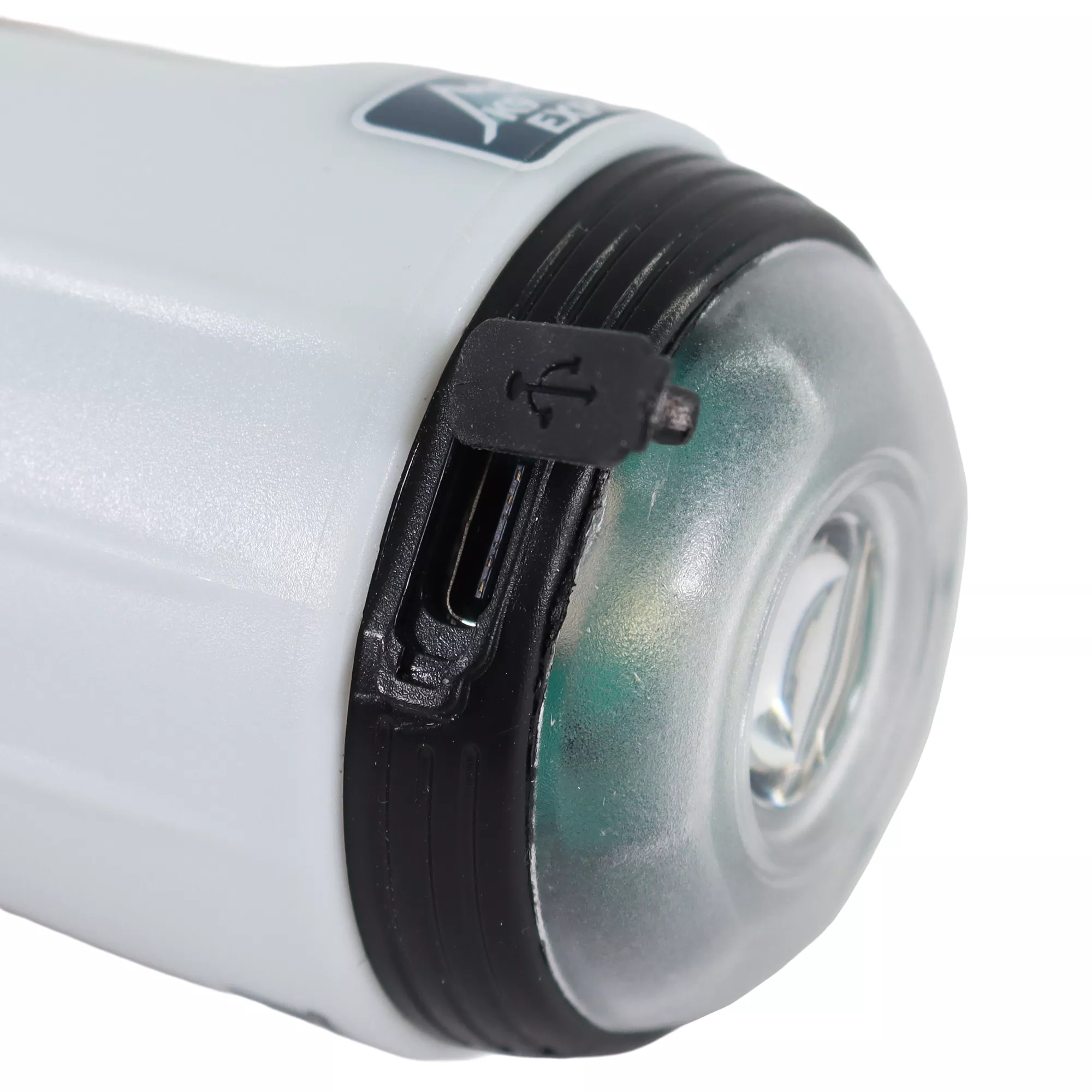 A white cylindrical waste bag dispenser is shown close up on a white background. The dispenser has a clear front lens covering a built‑in light.
