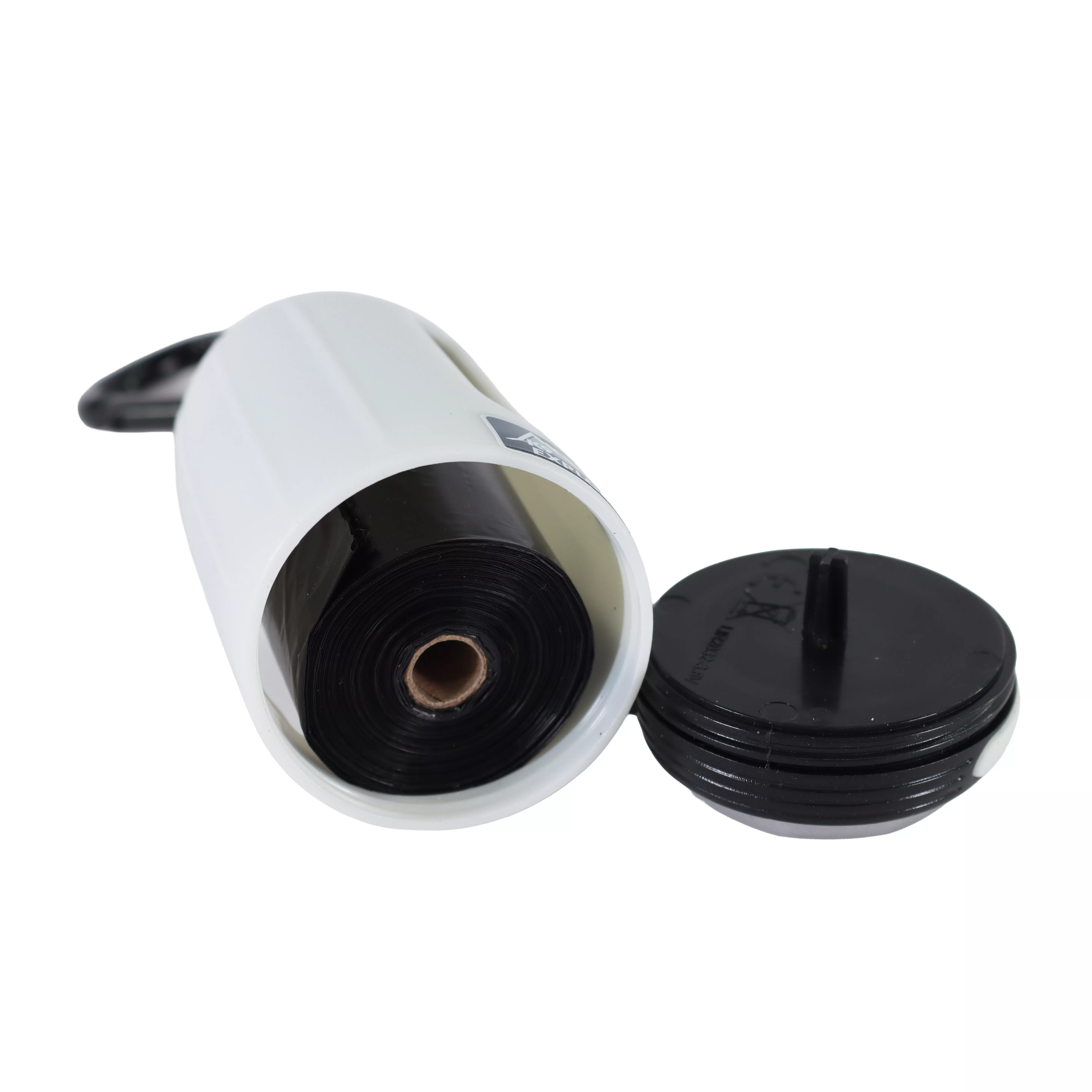 A white waste bag dispenser is positioned with its front lens facing upward. Next to it is a removable black plastic end cap. The cap has threading that allows it to twist onto the dispenser. A roll of black plastic waste bags is visible inside the dispenser.