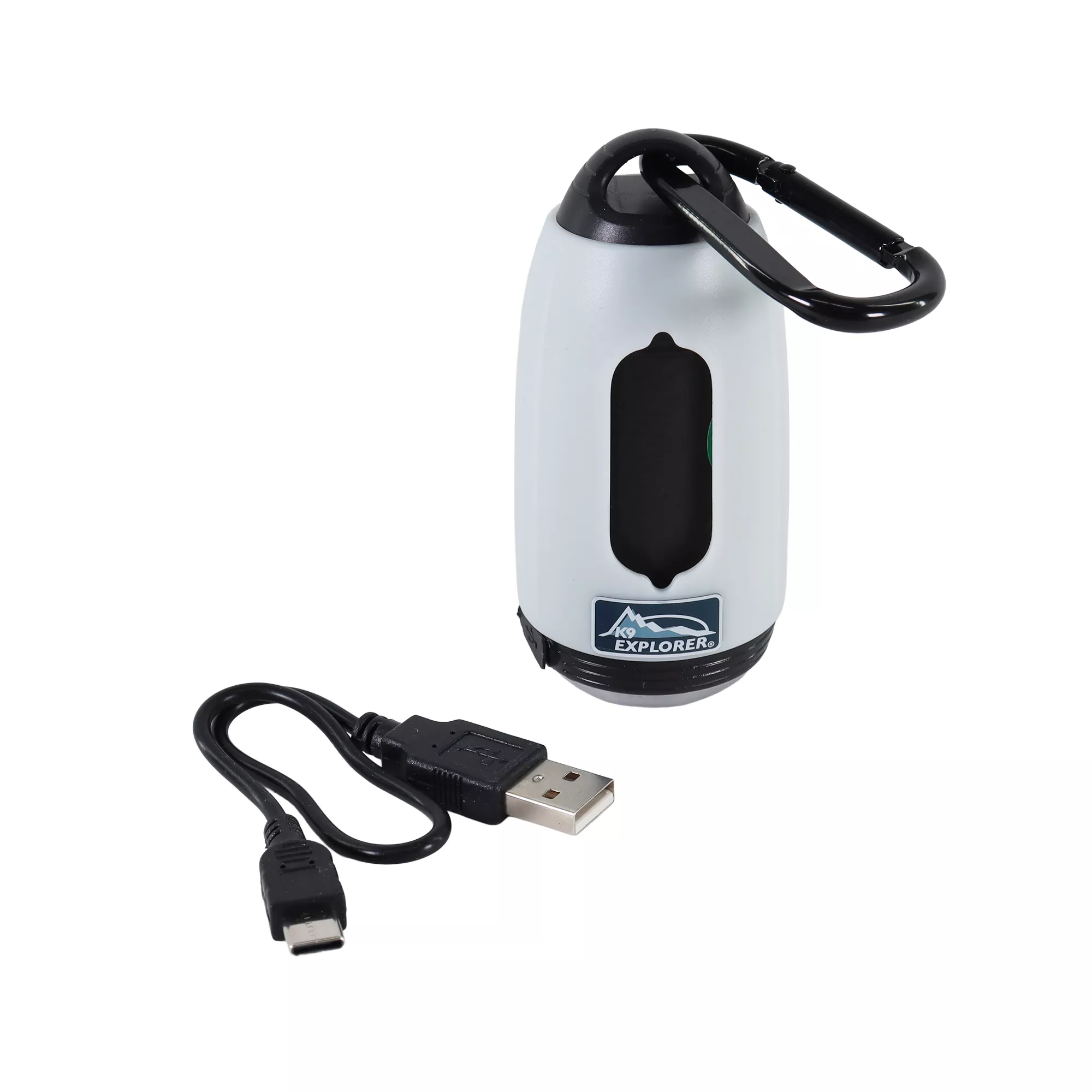 A white waste bag dispenser is displayed upright against a white background. A black plastic hook is attached at the top. A black vertical window is centered on the body. A short USB charging cable are shown next to the dispenser.