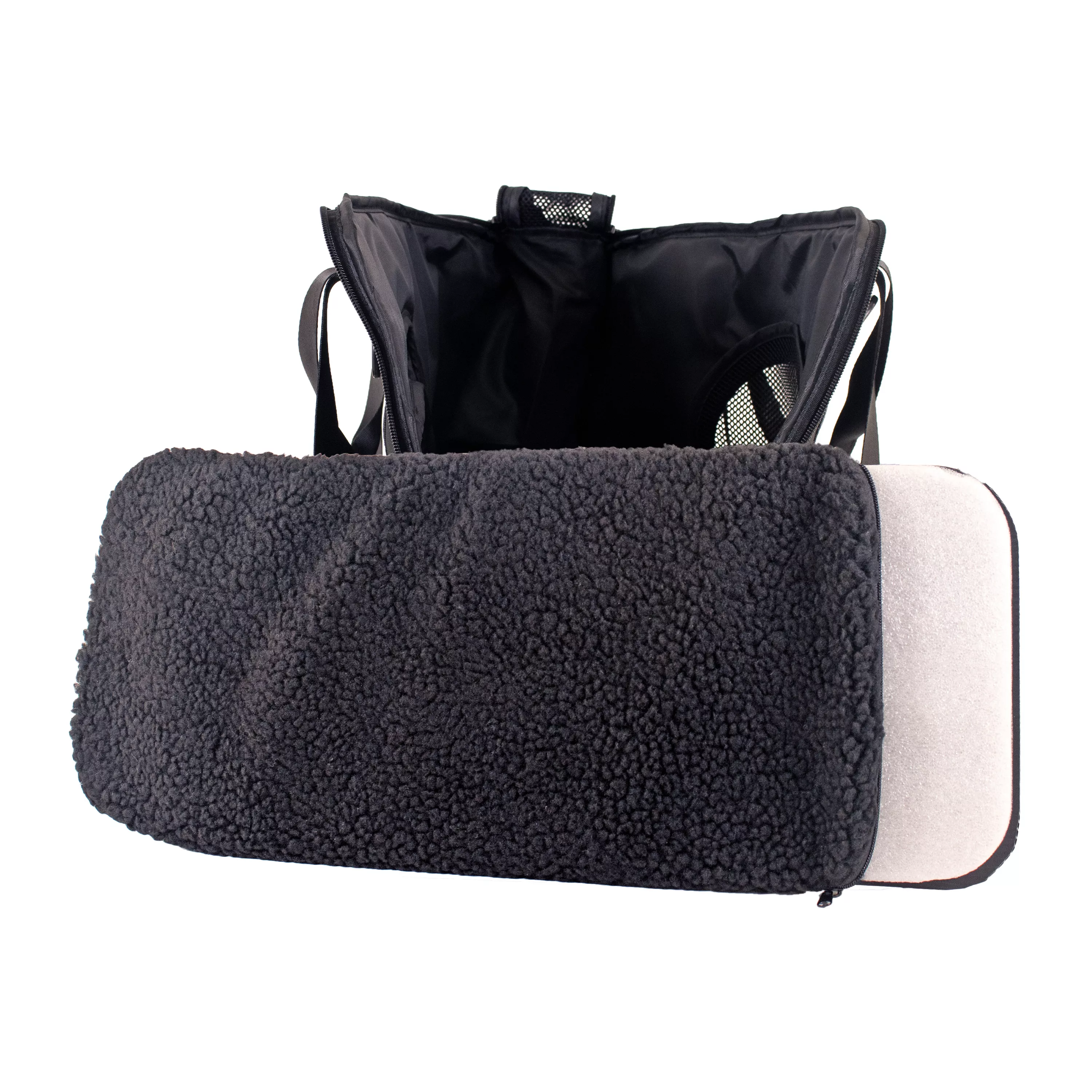 Side view of the tote pet carrier with the removable fleece pad pulled out and resting in front of the opening.