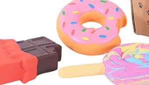 A group of donut and pastry‑shaped dog toys displayed together.