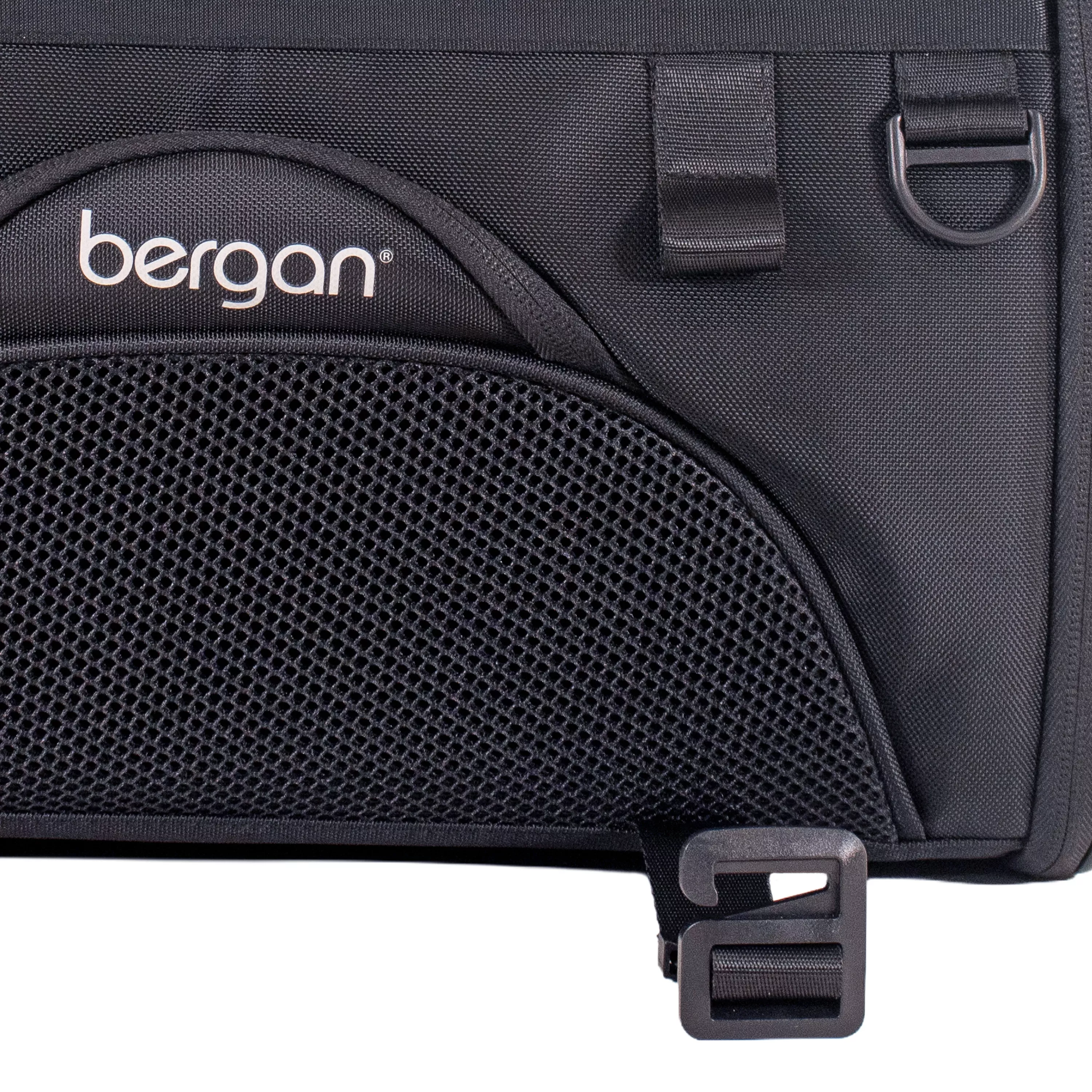 Close‑up of the front panel of the pet carrier, showing the brand logo, mesh front pocket, and adjustable buckle strap.