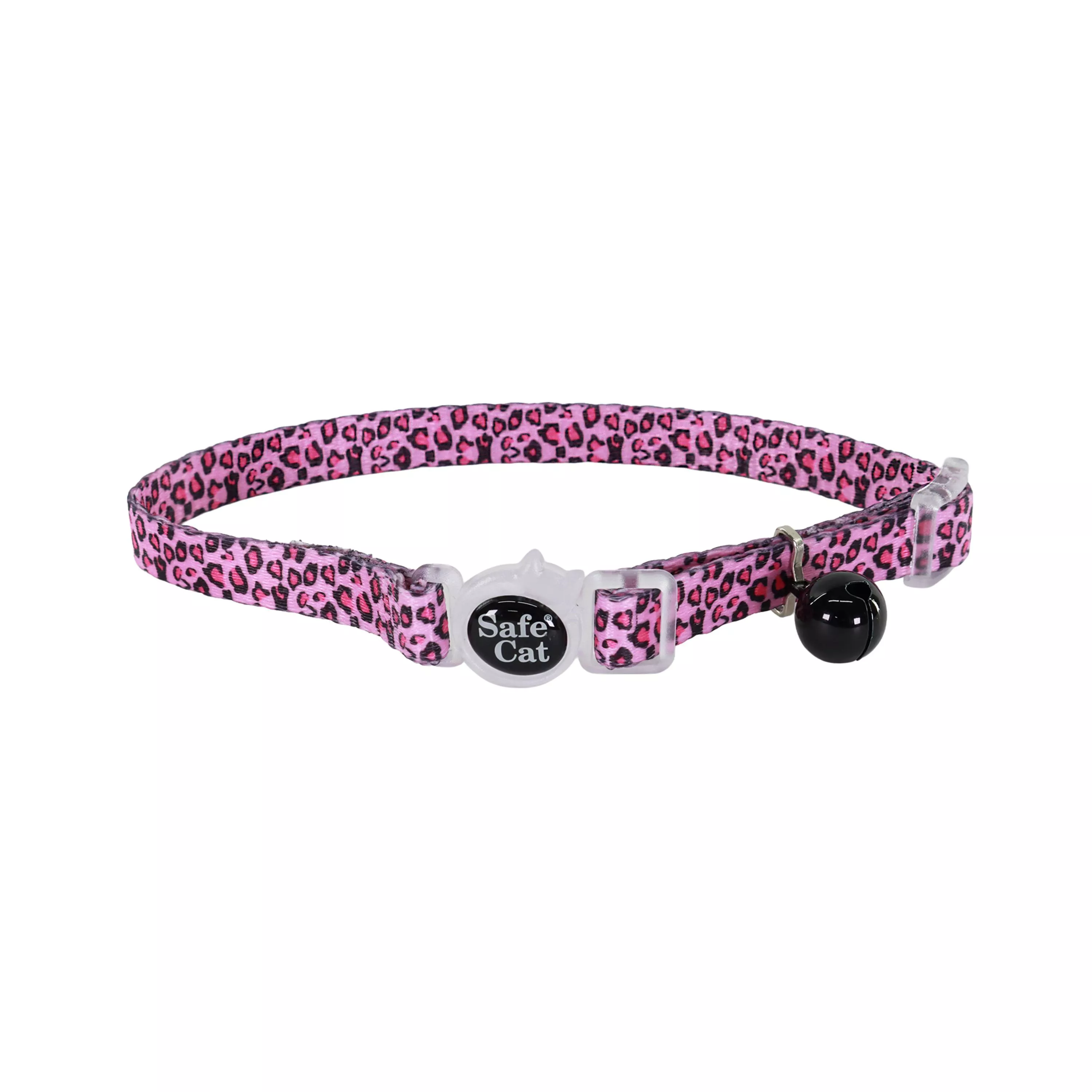 A product image of an adjustable breakaway collar labeled Pink Cheetah. The strap has a pink background with a repeating cheetah‑spot pattern in black and darker pink. The buckle is black plastic with rounded edges. A coordinating black bell hangs from a metal ring attached near the buckle.