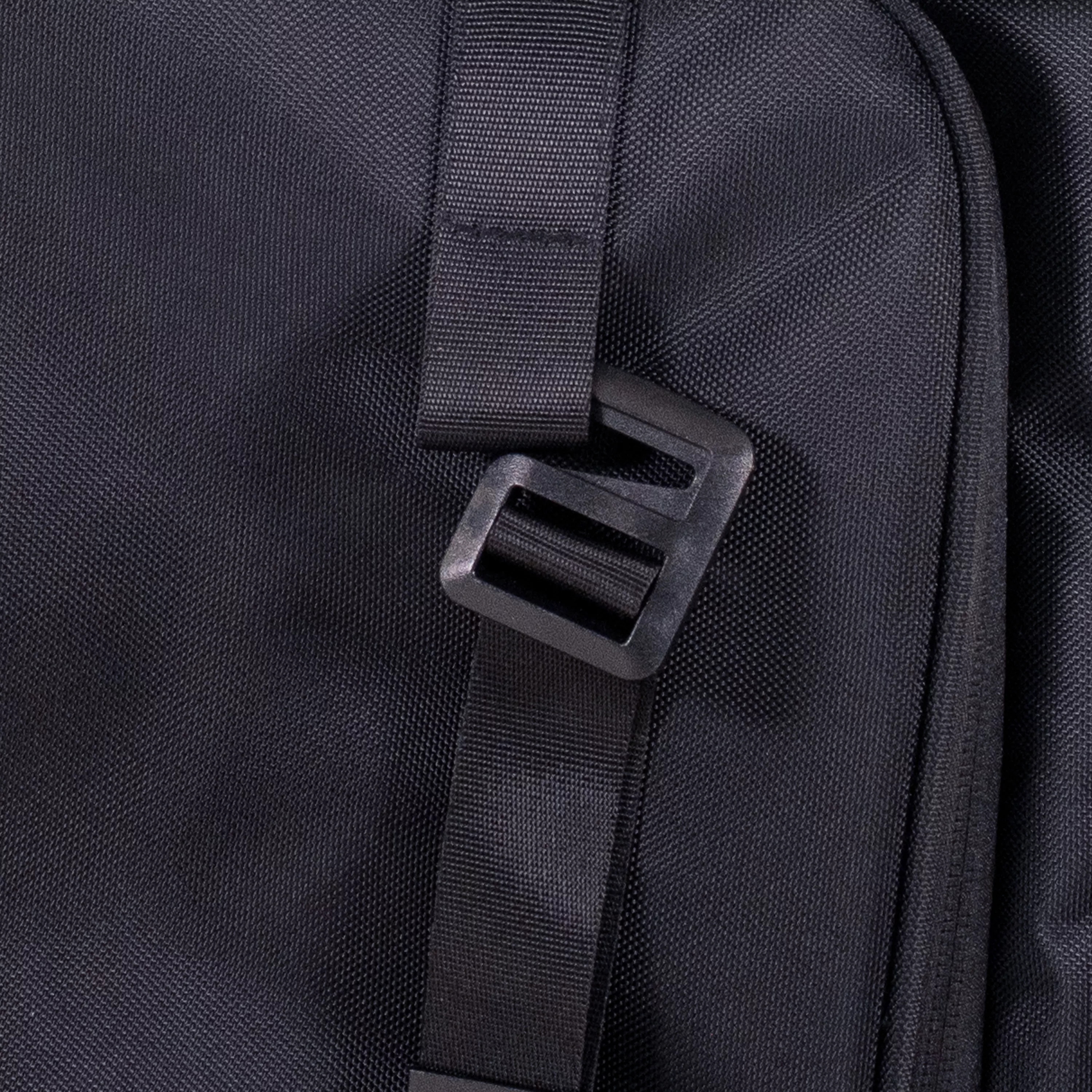 Close‑up of the side panel buckle used to secure the expandable compartment when collapsed.