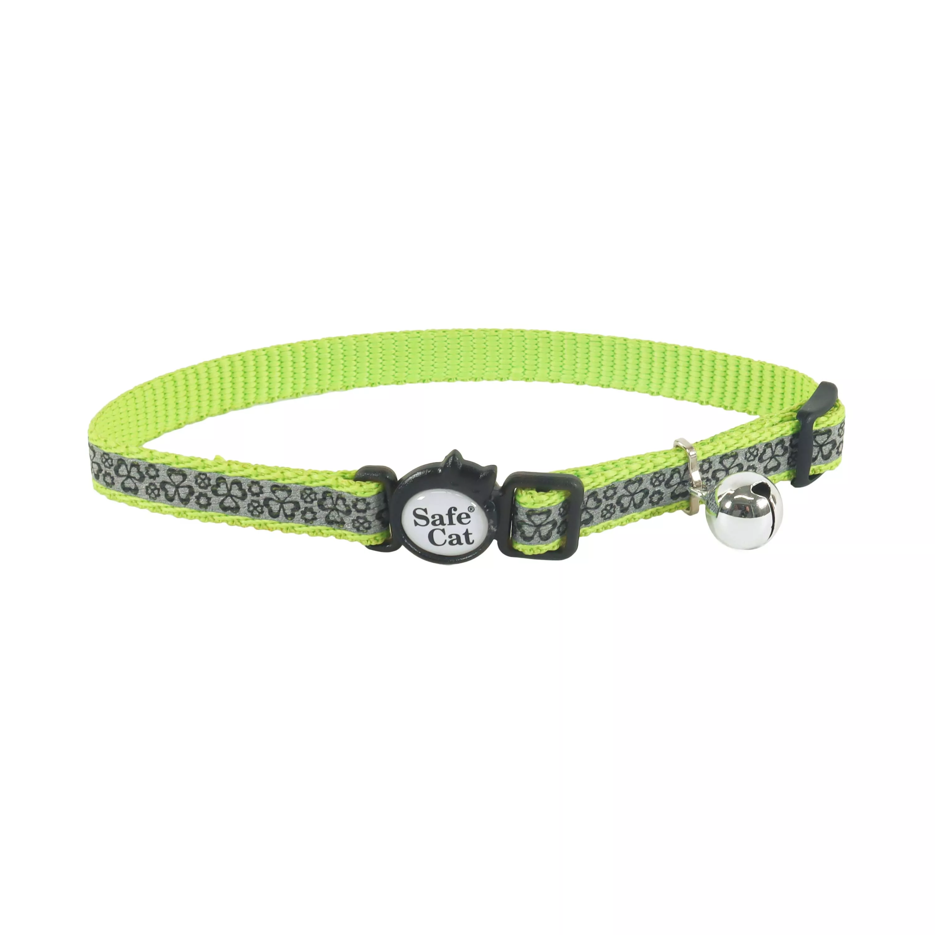 A green reflective breakaway cat collar is displayed against a white background. The strap features a repeating shamrock pattern in light green on a darker green base. The collar includes a green plastic breakaway buckle, a green adjustment slider, and a silver metal split ring with a small silver bell attached.