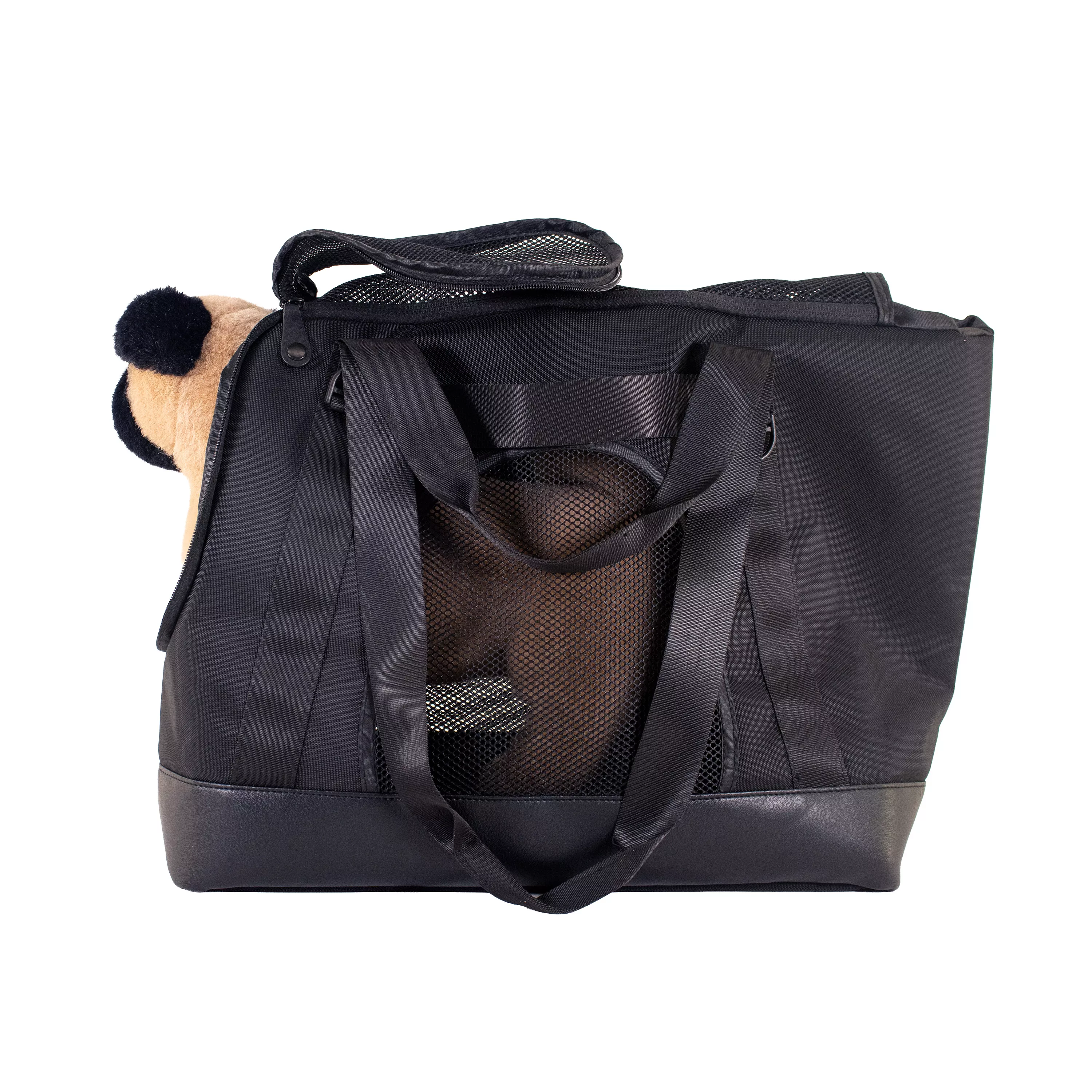 Side view of the tote carrier with a small dog sitting inside, the top open and one shoulder strap hanging along the side.