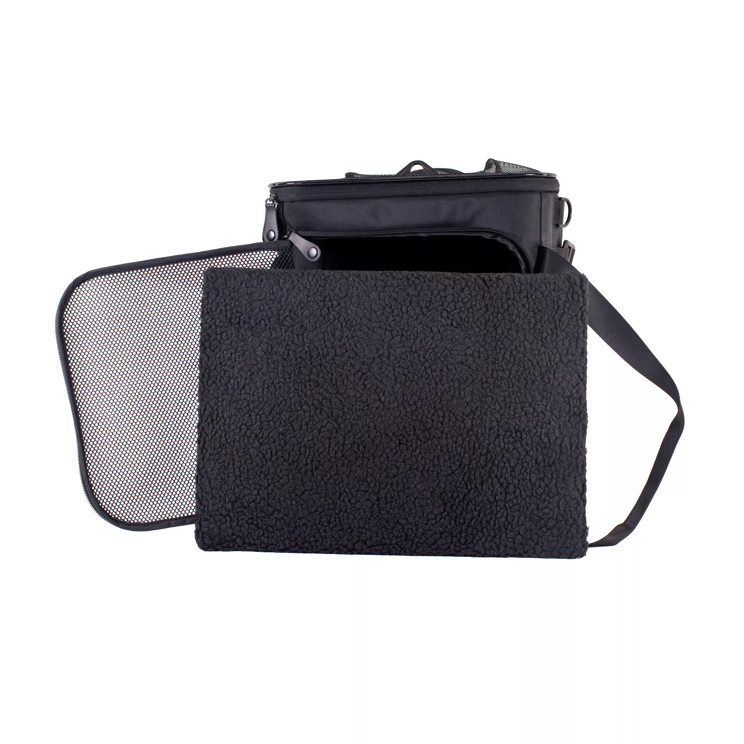Side view of the pet carrier with the removable fleece pad fully removed and positioned directly in front of the open entrance.